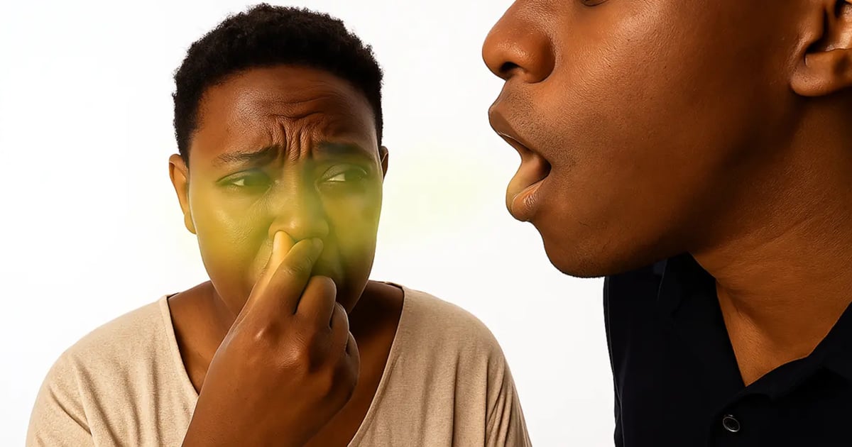 Woman covering her nose because of a man with bad breath