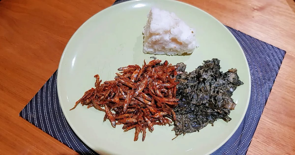 Traditional Kenyan meal featuring omena (silver cyprinid) served with vegetables and ugali