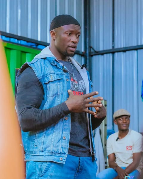 Jibril Iron Shaffi addressing athletes at Hood Gym about the future of bodybuilding in Kenya