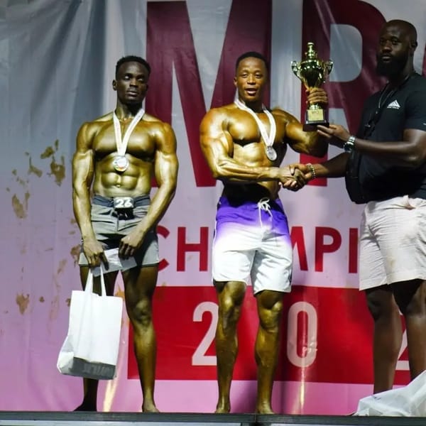 Joseph Joe Ripper Kabugi receiving the Men