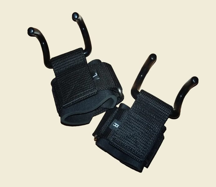 Close-up view of lifting hooks showing padded wrist cuff and metal hook attachment