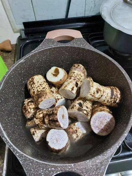 Nduma taro preparation in sufuria showing peeled roots ready for traditional Kenyan cooking