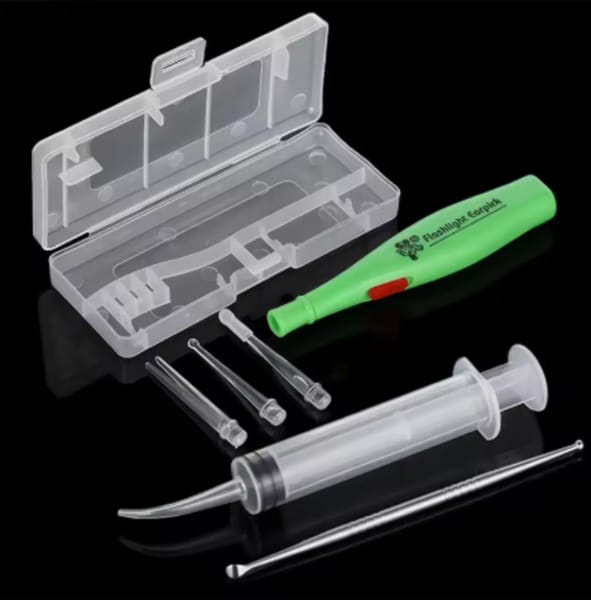 Tonsil stone removal tools including a scoop and syringe